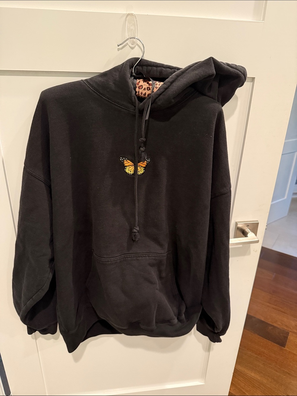 Brandy Melville Black Hoodie with Yellow-Orange Butterfly Embroidery